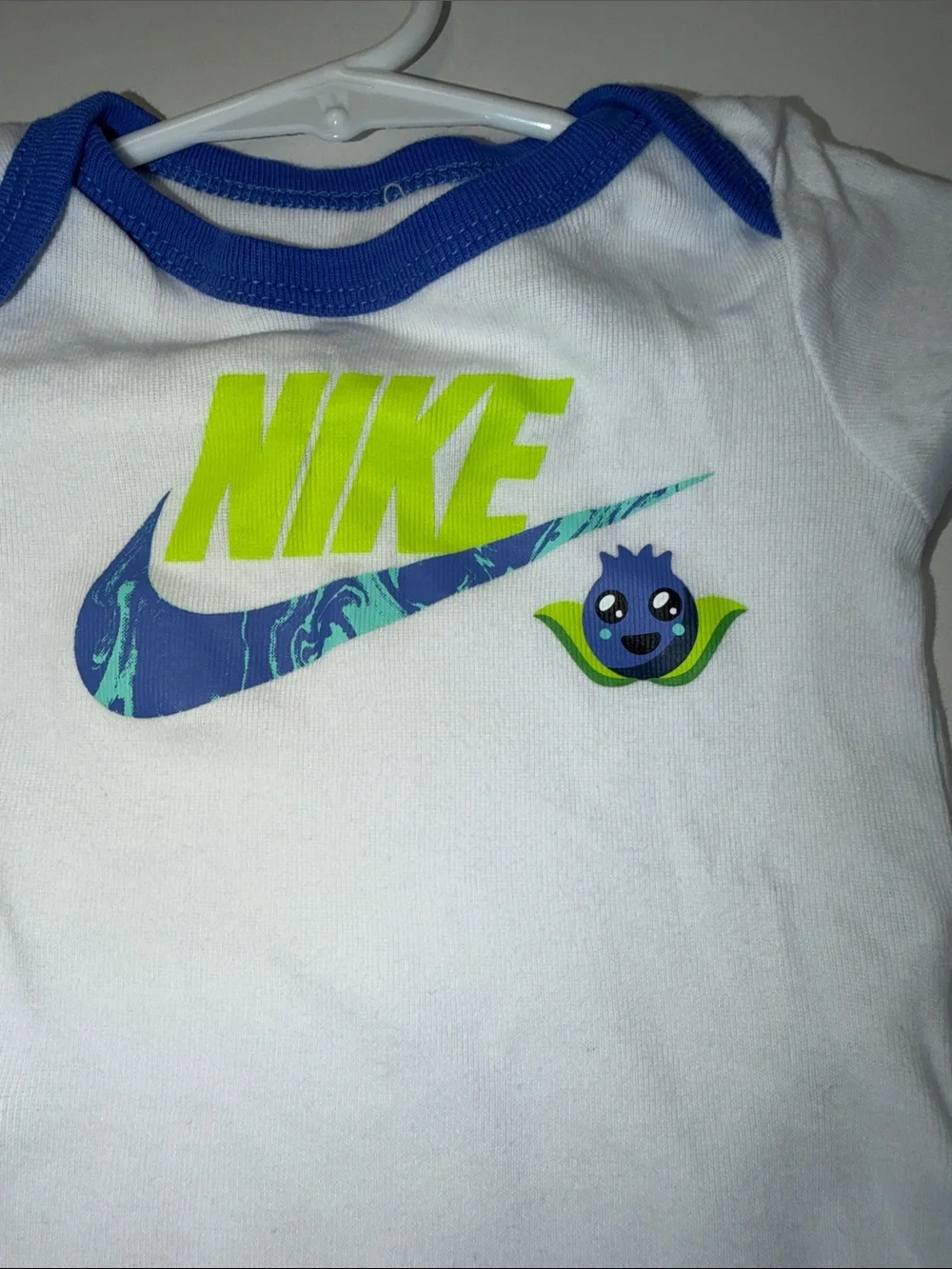 Baby Nike White One-Piece Bodysuit with Blue Trim & Neon Green Logo‎